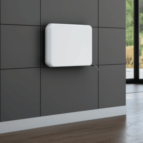 a squared wall with a white device